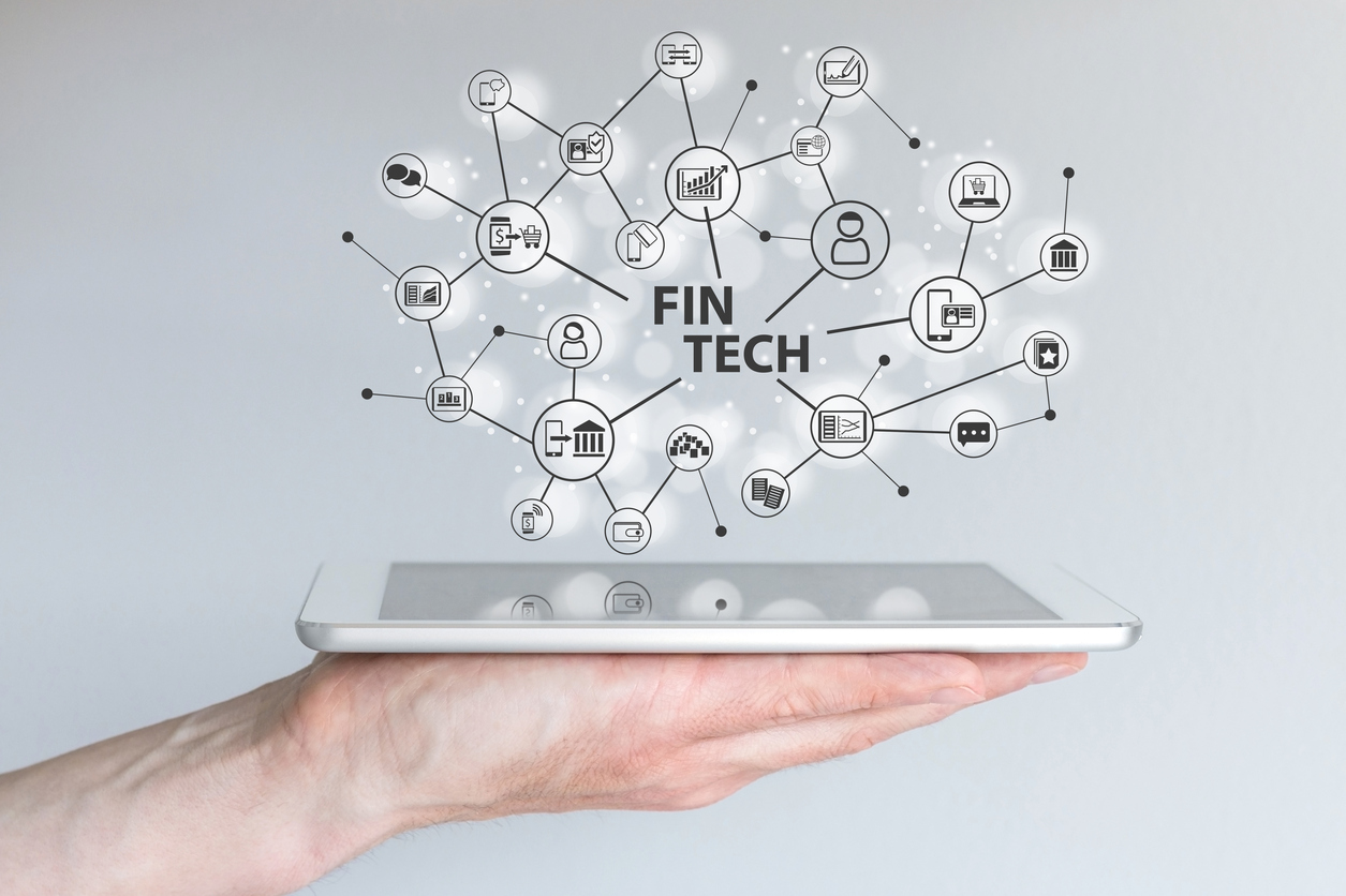 ill.bilde. Fin Tech and mobile computing concept. Hand holding tablet